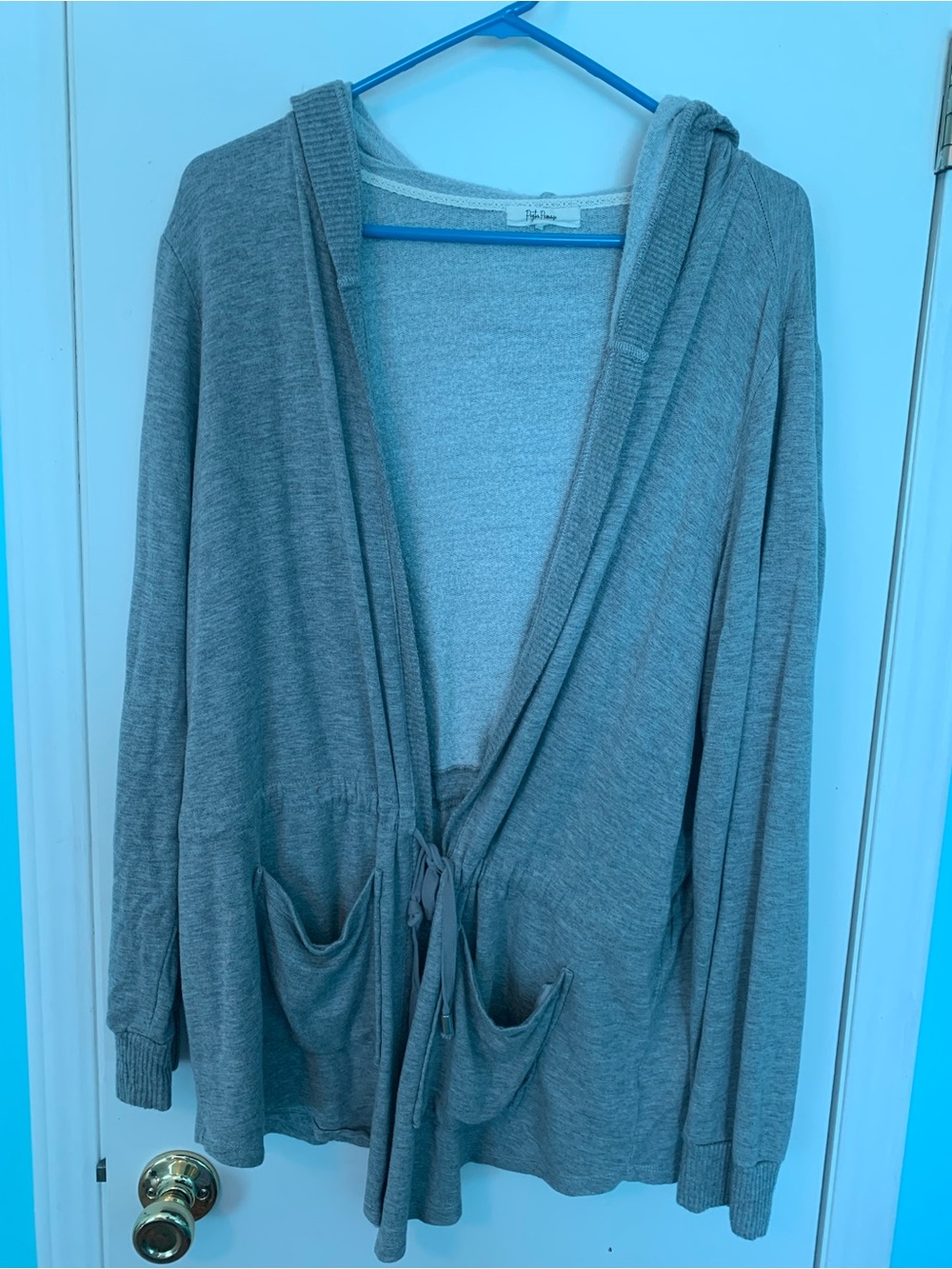 2 light gray hoodies